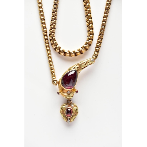 14 - A VICTORIAN GARNET SET GOLD SNAKE NECKLACE, the serpent's head set with a pear shape garnet cabochon... 