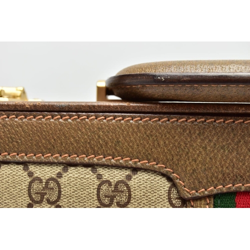 140 - A VINTAGE GUCCI BRIEFCASE WITH GREEN LEATHER TRIM, the front and back vinyl panels with Gucci logos ... 