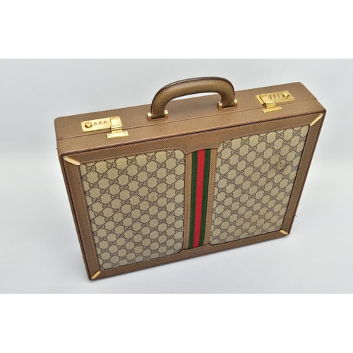 140 - A VINTAGE GUCCI BRIEFCASE WITH GREEN LEATHER TRIM, the front and back vinyl panels with Gucci logos ... 