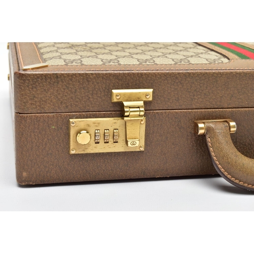 140 - A VINTAGE GUCCI BRIEFCASE WITH GREEN LEATHER TRIM, the front and back vinyl panels with Gucci logos ... 