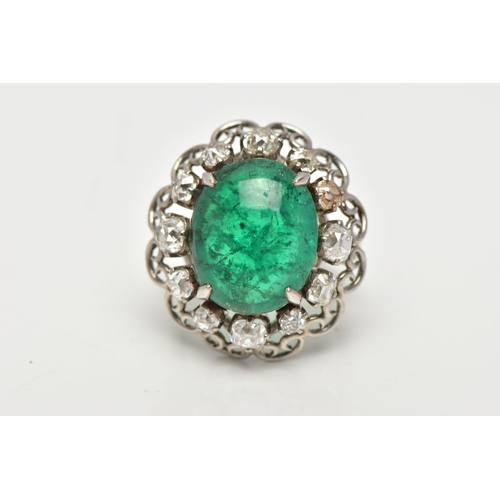 15 - AN EMERALD AND DIAMOND WHITE METAL CLUSTER RING, the principal oval cabochon emerald, measuring appr... 