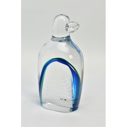 177 - GORAN WARFF FOR KOSTA BODA, a glass penguin paperweight having a green and blue internal stripe and ... 