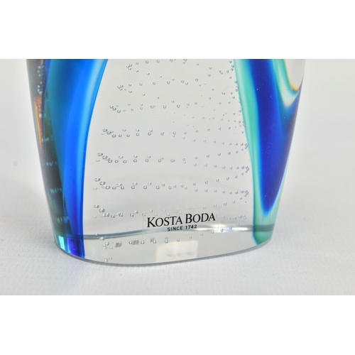 177 - GORAN WARFF FOR KOSTA BODA, a glass penguin paperweight having a green and blue internal stripe and ... 