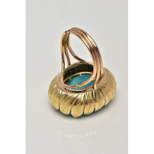 19 - A MID 20TH CENTURY TURQUOISE YELLOW METAL COCKTAIL RING, set with a principal oval flat polished top... 