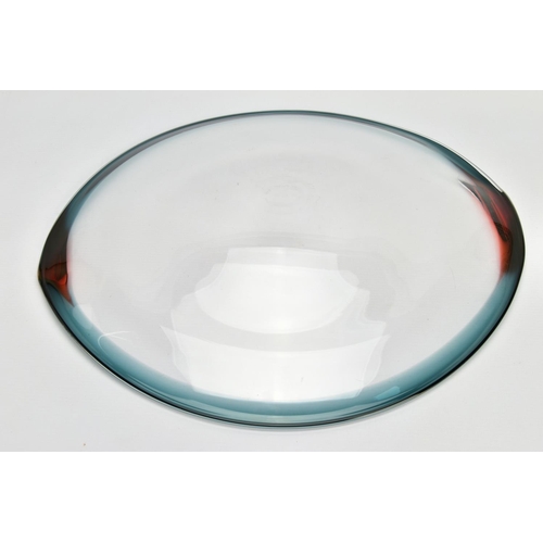 198 - NEIL WILKIN (BRITISH 20TH CENTURY) A LARGE SHALLOW GLASS BOWL, having a clear body and coloured rim,... 