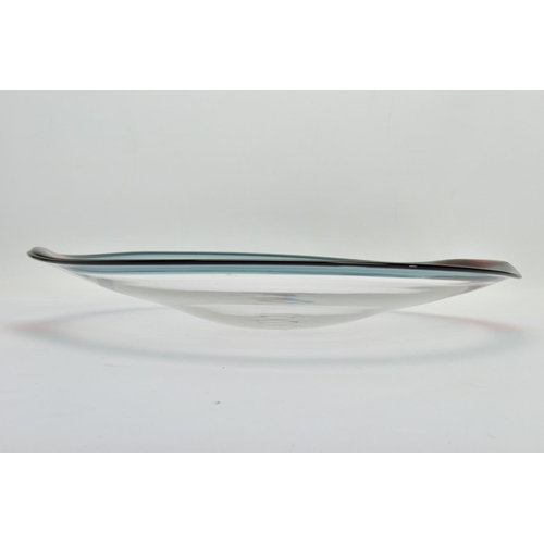 198 - NEIL WILKIN (BRITISH 20TH CENTURY) A LARGE SHALLOW GLASS BOWL, having a clear body and coloured rim,... 