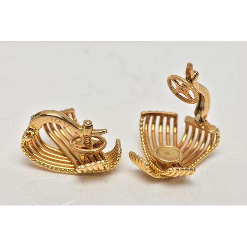 20 - A PAIR OF MID 20TH CENTURY CARTIER EARRINGS CIRCA 1960s, each ear clip designed as a wirework crosso... 