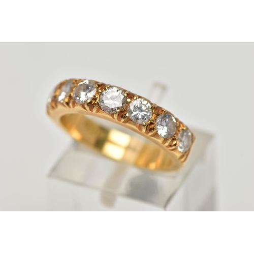 21 - A MODERN 18CT YELLOW GOLD DIAMOND SEVEN STONE RING, set with round brilliant cut diamonds, measuring... 