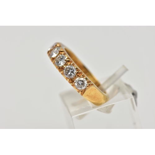 21 - A MODERN 18CT YELLOW GOLD DIAMOND SEVEN STONE RING, set with round brilliant cut diamonds, measuring... 