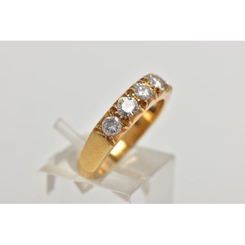 21 - A MODERN 18CT YELLOW GOLD DIAMOND SEVEN STONE RING, set with round brilliant cut diamonds, measuring... 