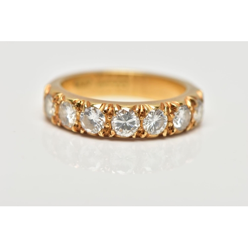 21 - A MODERN 18CT YELLOW GOLD DIAMOND SEVEN STONE RING, set with round brilliant cut diamonds, measuring... 