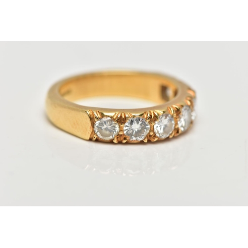 21 - A MODERN 18CT YELLOW GOLD DIAMOND SEVEN STONE RING, set with round brilliant cut diamonds, measuring... 