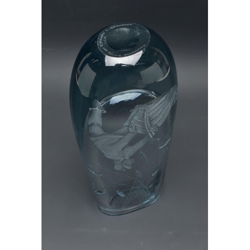 214 - A STROMBERGSHYTTAN WHEEL ENGRAVED VASE OF A FISHERMAN LANDING HIS CATCH, the vase design by Asta Str... 