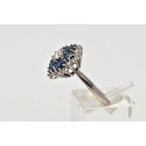 22 - A SAPPHIRE AND DIAMOND CLUSTER RING, set with a principal round brilliant-cut diamond, surrounded by... 