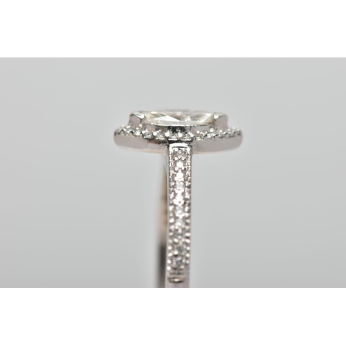 23 - A PLATINUM DIAMOND HALO RING, centring on a marquise cut diamond, estimated diamond weight 0.50cts, ... 