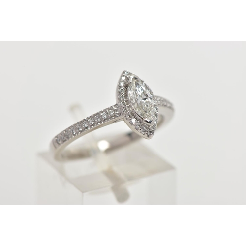 23 - A PLATINUM DIAMOND HALO RING, centring on a marquise cut diamond, estimated diamond weight 0.50cts, ... 