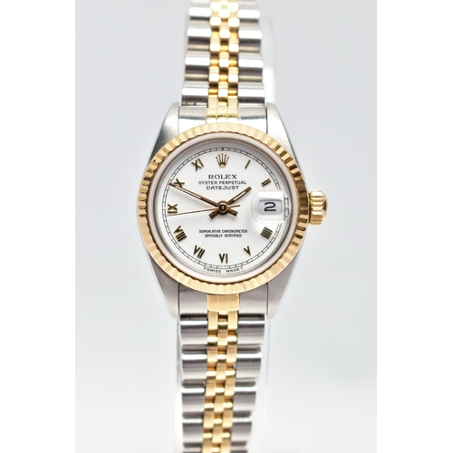 29 - A ROLEX DATEJUST WRISTWATCH, the white dial with gold tone luminescent Roman Numerals, gold tone lum... 