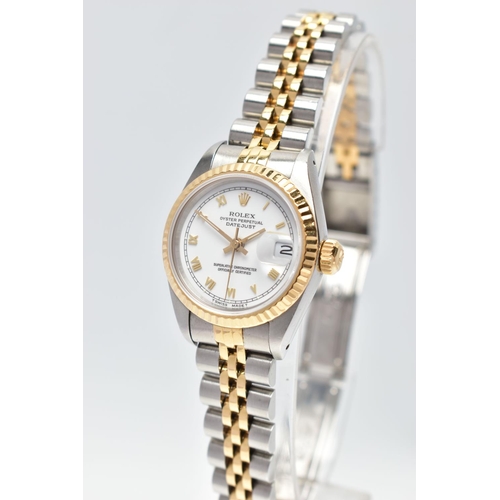 29 - A ROLEX DATEJUST WRISTWATCH, the white dial with gold tone luminescent Roman Numerals, gold tone lum... 