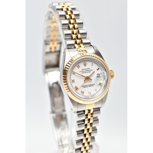 29 - A ROLEX DATEJUST WRISTWATCH, the white dial with gold tone luminescent Roman Numerals, gold tone lum... 