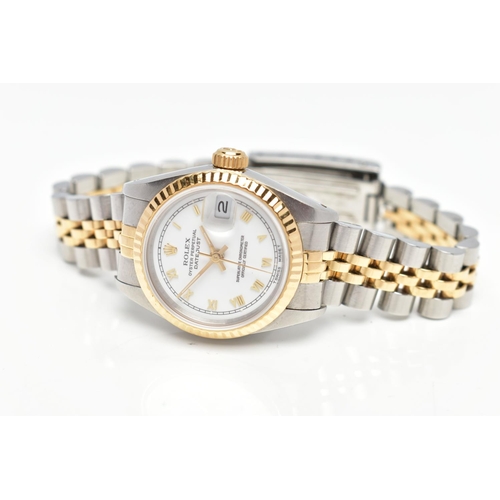 29 - A ROLEX DATEJUST WRISTWATCH, the white dial with gold tone luminescent Roman Numerals, gold tone lum... 