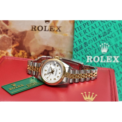 29 - A ROLEX DATEJUST WRISTWATCH, the white dial with gold tone luminescent Roman Numerals, gold tone lum... 