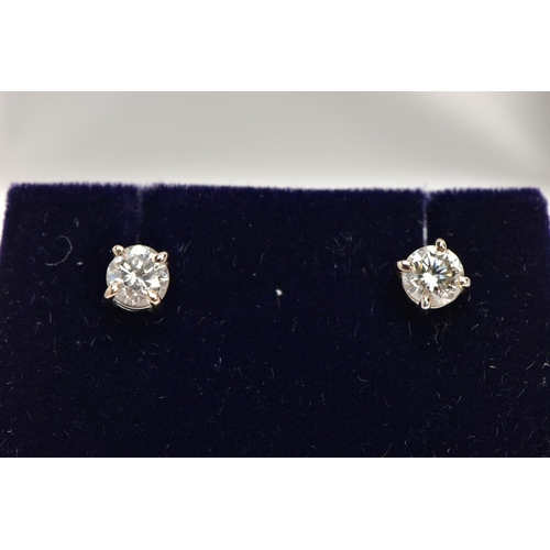 3 - A MODERN PAIR OF 18CT WHITE GOLD DIAMOND STUD EARRINGS, estimated total modern round brilliant cut w... 