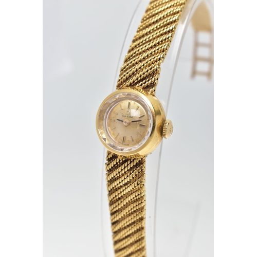 33 - AN 18CT GOLD OMEGA WRISTWATCH, hand wound movement, round gold dial signed 'Omega', baton markers, p... 