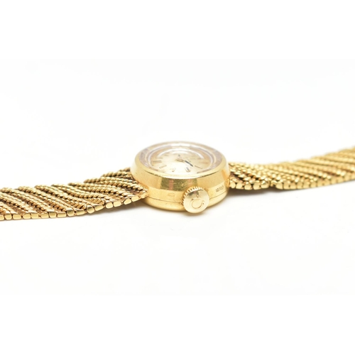 33 - AN 18CT GOLD OMEGA WRISTWATCH, hand wound movement, round gold dial signed 'Omega', baton markers, p... 