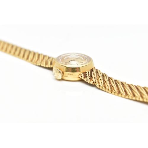 33 - AN 18CT GOLD OMEGA WRISTWATCH, hand wound movement, round gold dial signed 'Omega', baton markers, p... 