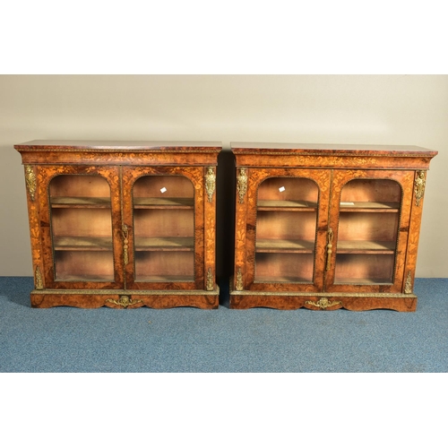 344 - A PAIR OF 19TH CENTURY FRENCH BURR WALNUT AND MARQUETRY INLAID BOOKCASES, the double glazed doors en... 