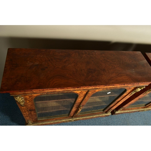 344 - A PAIR OF 19TH CENTURY FRENCH BURR WALNUT AND MARQUETRY INLAID BOOKCASES, the double glazed doors en... 