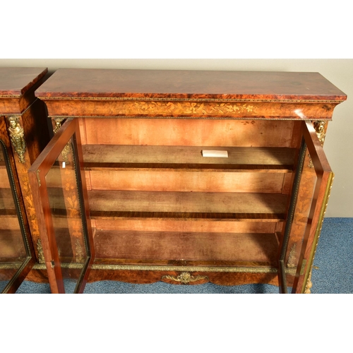 344 - A PAIR OF 19TH CENTURY FRENCH BURR WALNUT AND MARQUETRY INLAID BOOKCASES, the double glazed doors en... 