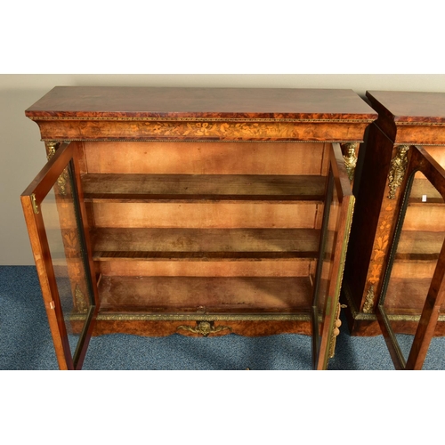 344 - A PAIR OF 19TH CENTURY FRENCH BURR WALNUT AND MARQUETRY INLAID BOOKCASES, the double glazed doors en... 