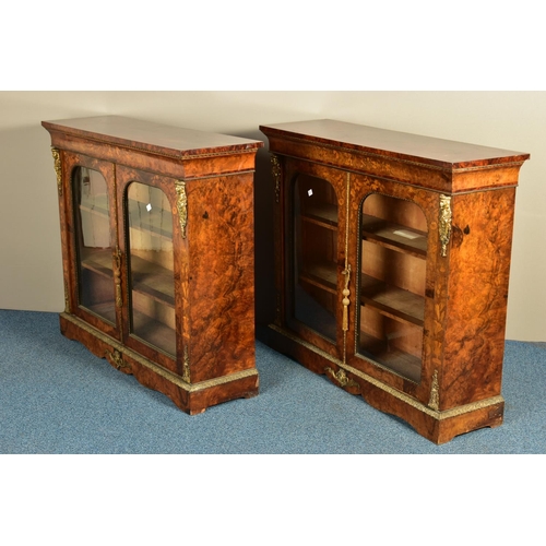 344 - A PAIR OF 19TH CENTURY FRENCH BURR WALNUT AND MARQUETRY INLAID BOOKCASES, the double glazed doors en... 