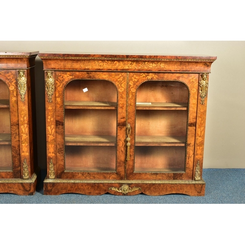 344 - A PAIR OF 19TH CENTURY FRENCH BURR WALNUT AND MARQUETRY INLAID BOOKCASES, the double glazed doors en... 