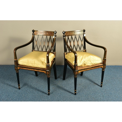 345 - A PAIR OF SHERATON REVIVAL EBONISED AND PARCEL-GILT ARMCHAIRS, c1820, with a Greek pattern to the to... 