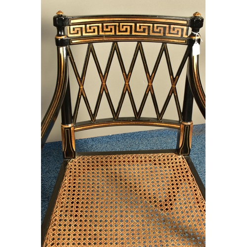 345 - A PAIR OF SHERATON REVIVAL EBONISED AND PARCEL-GILT ARMCHAIRS, c1820, with a Greek pattern to the to... 