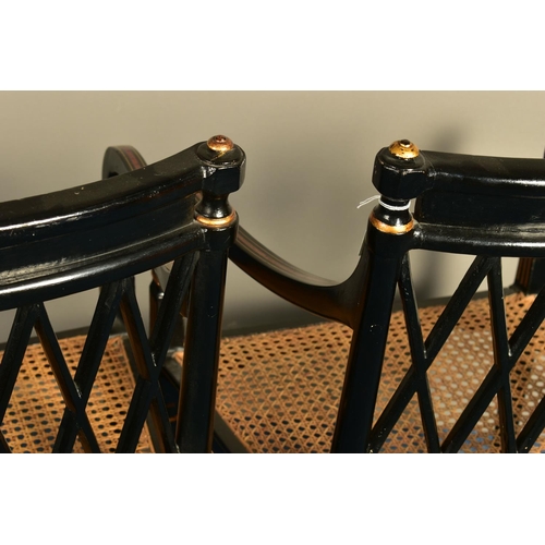 345 - A PAIR OF SHERATON REVIVAL EBONISED AND PARCEL-GILT ARMCHAIRS, c1820, with a Greek pattern to the to... 