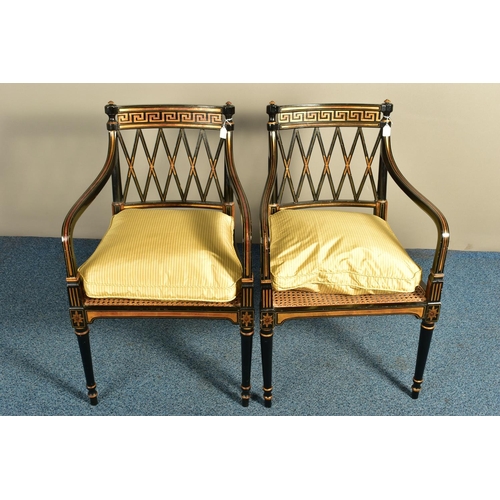 345 - A PAIR OF SHERATON REVIVAL EBONISED AND PARCEL-GILT ARMCHAIRS, c1820, with a Greek pattern to the to... 