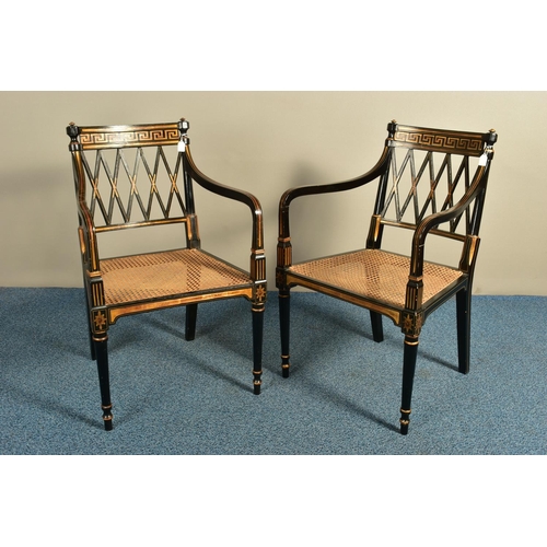 345 - A PAIR OF SHERATON REVIVAL EBONISED AND PARCEL-GILT ARMCHAIRS, c1820, with a Greek pattern to the to... 