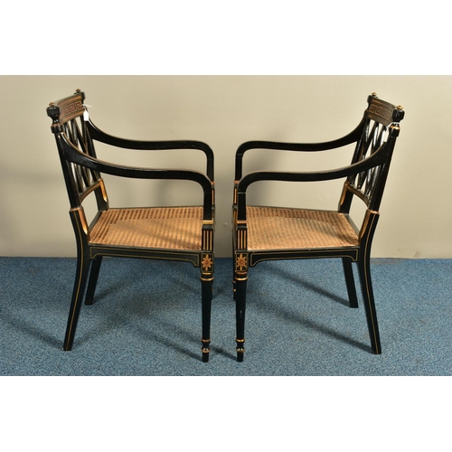 345 - A PAIR OF SHERATON REVIVAL EBONISED AND PARCEL-GILT ARMCHAIRS, c1820, with a Greek pattern to the to... 