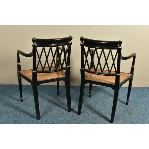 345 - A PAIR OF SHERATON REVIVAL EBONISED AND PARCEL-GILT ARMCHAIRS, c1820, with a Greek pattern to the to... 