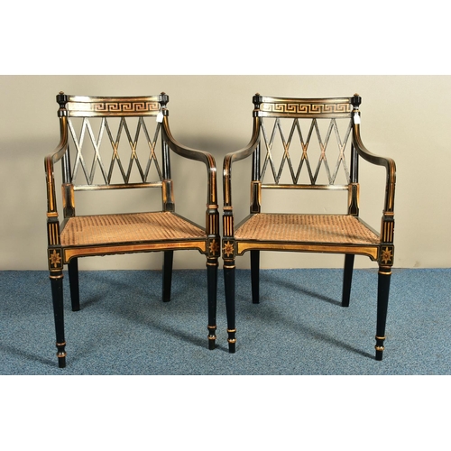 345 - A PAIR OF SHERATON REVIVAL EBONISED AND PARCEL-GILT ARMCHAIRS, c1820, with a Greek pattern to the to... 