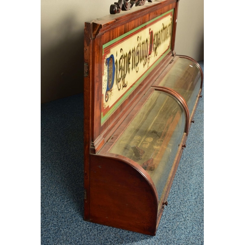 346 - A 19TH CENTURY MAHOGANY DISPENSING APOTHECARY CABINET, with an carved foliate surmount, coloured gla... 