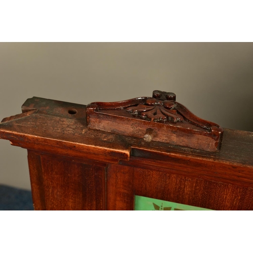 346 - A 19TH CENTURY MAHOGANY DISPENSING APOTHECARY CABINET, with an carved foliate surmount, coloured gla... 