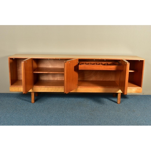 348 - GORDON RUSSELL (BRITISH 1892-1980) A 1960'S ROSEWOOD AND TEAK 7FT SIDEBOARD, the six doors with book... 