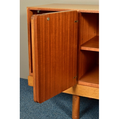 348 - GORDON RUSSELL (BRITISH 1892-1980) A 1960'S ROSEWOOD AND TEAK 7FT SIDEBOARD, the six doors with book... 