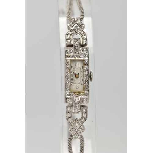 35 - AN EARLY TWENTIETH CENTURY DIAMOND COCKTAIL WATCH, a rectangular diamond case, measuring 23.0mm x 11... 