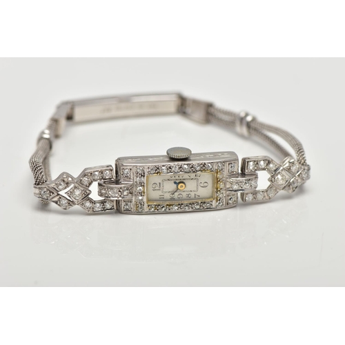 35 - AN EARLY TWENTIETH CENTURY DIAMOND COCKTAIL WATCH, a rectangular diamond case, measuring 23.0mm x 11... 