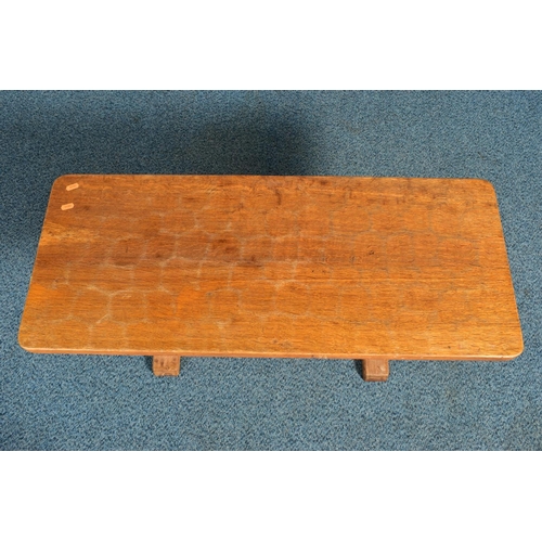 350 - ROBERT 'MOUSEMAN' THOMPSON OF KILBURN, A 3FT OAK RECTANGULAR COFFEE TABLE, with an adzed top, twin o... 